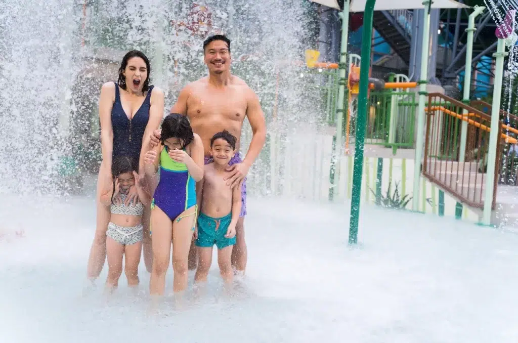 Family in water feature at waterpark