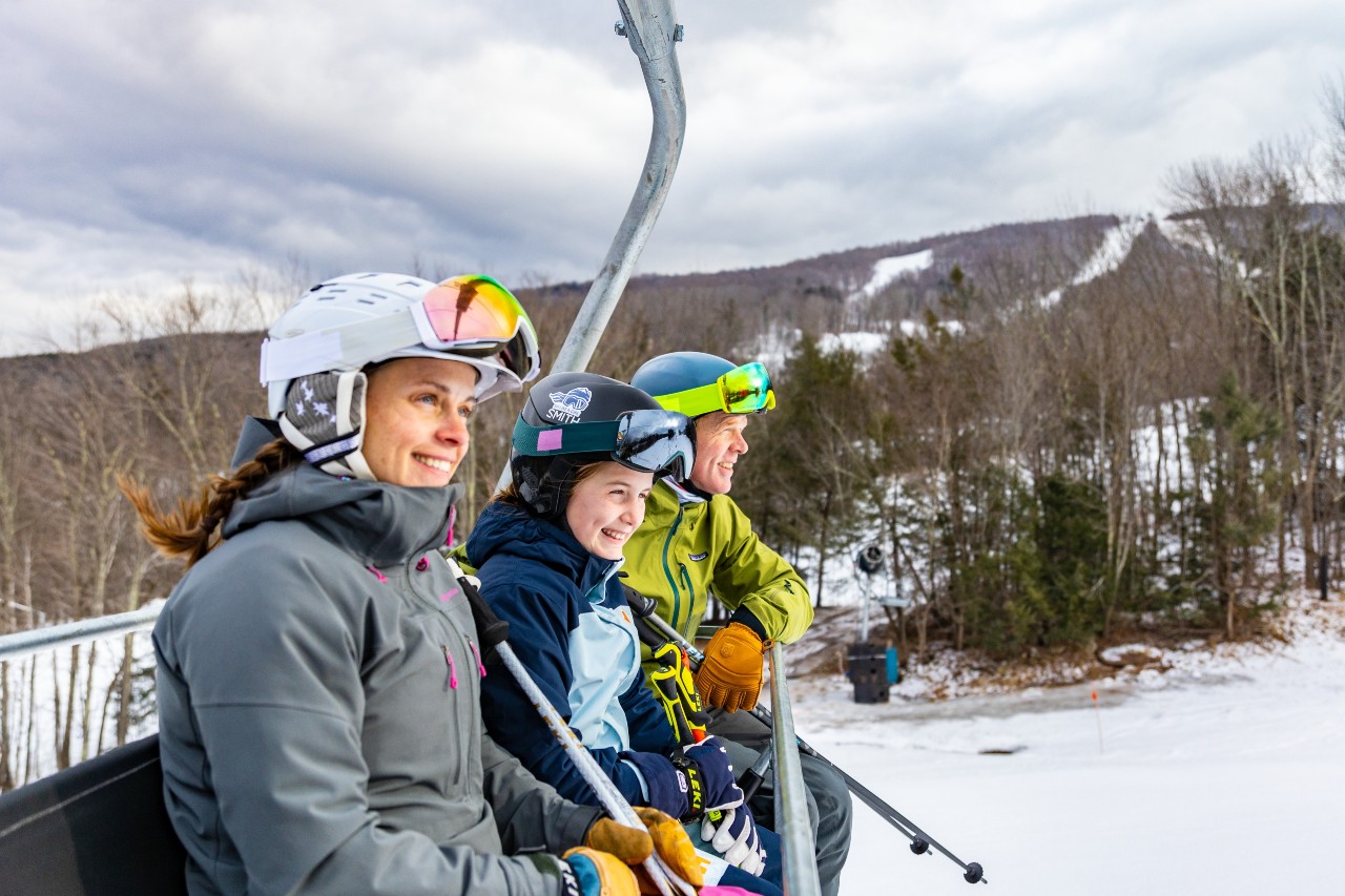 Family on smiling on a ski lift