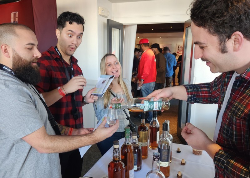 People pouring and enjoying libations at Boutique Wines, Spirits and Ciders in Fishkill.