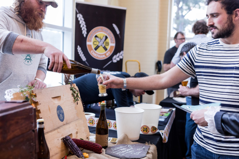 People pouring and sampling beer at Brew U at the Culinary Institute of America in Hyde Park