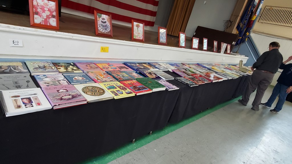 A display of books and pictures at the 20th Century Glass, Pottery, China and Accessories Show and Sale at the Beacon Veterans Memorial Building