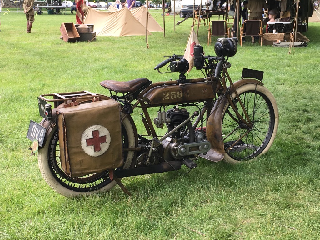 A World War II-era military motorcycle with a medical kit strapped to the back as it is parked on the Great Lawn at the Franklin D. Roosevelt Presidential Library and Museum in Hyde Park.