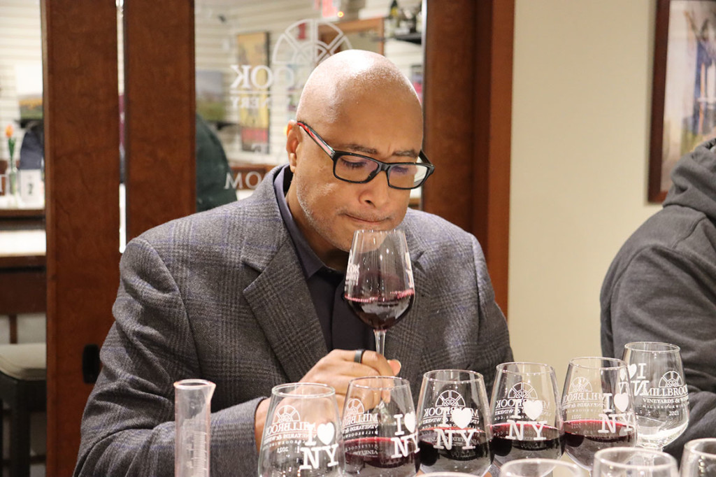 Jazz musician and former New York Yankees center fielder Bernie Williams examines a glass of wine at Millbrook Vineyards and Winery in Millbrook. Photo courtesy of Millbrook Vineyards and Winery.