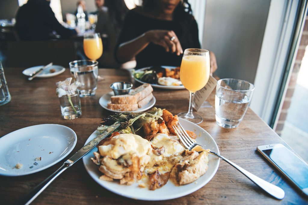 Plate of food and drinks at a brunch meal