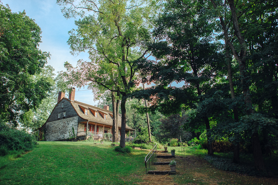 A view up the hill of the homestead at Mount Gulian Historic Site from the historic Dutch Barn.