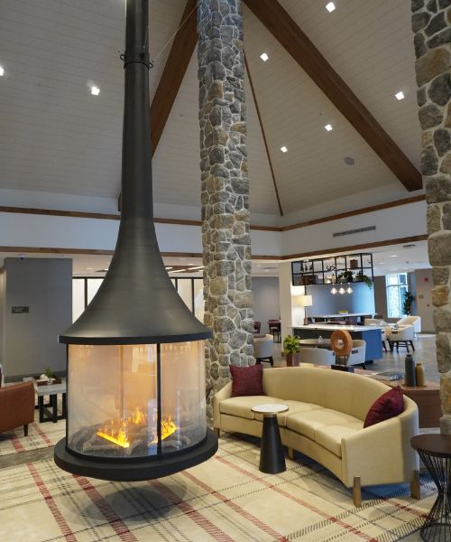 The lobby at the Inn at Bellefield in Hyde Park with its unique circular fireplace.