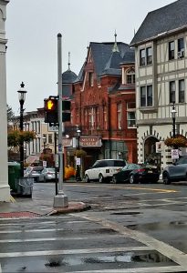 Tarrytown's Main Street with the brown exterior of the music hall.