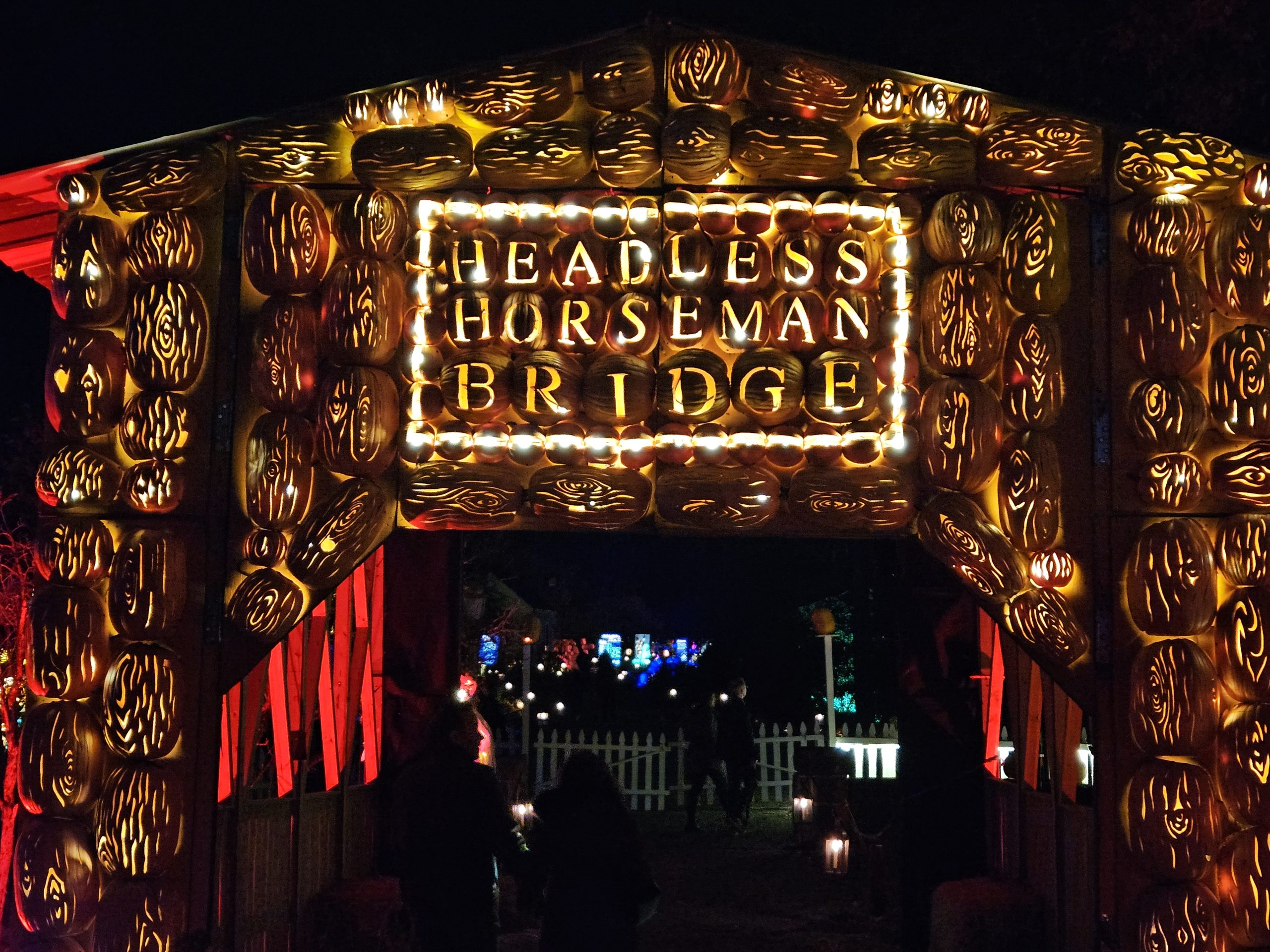 The Headless Horseman bridge alight with carved pumpkins.