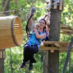 A woman on an aerial course.