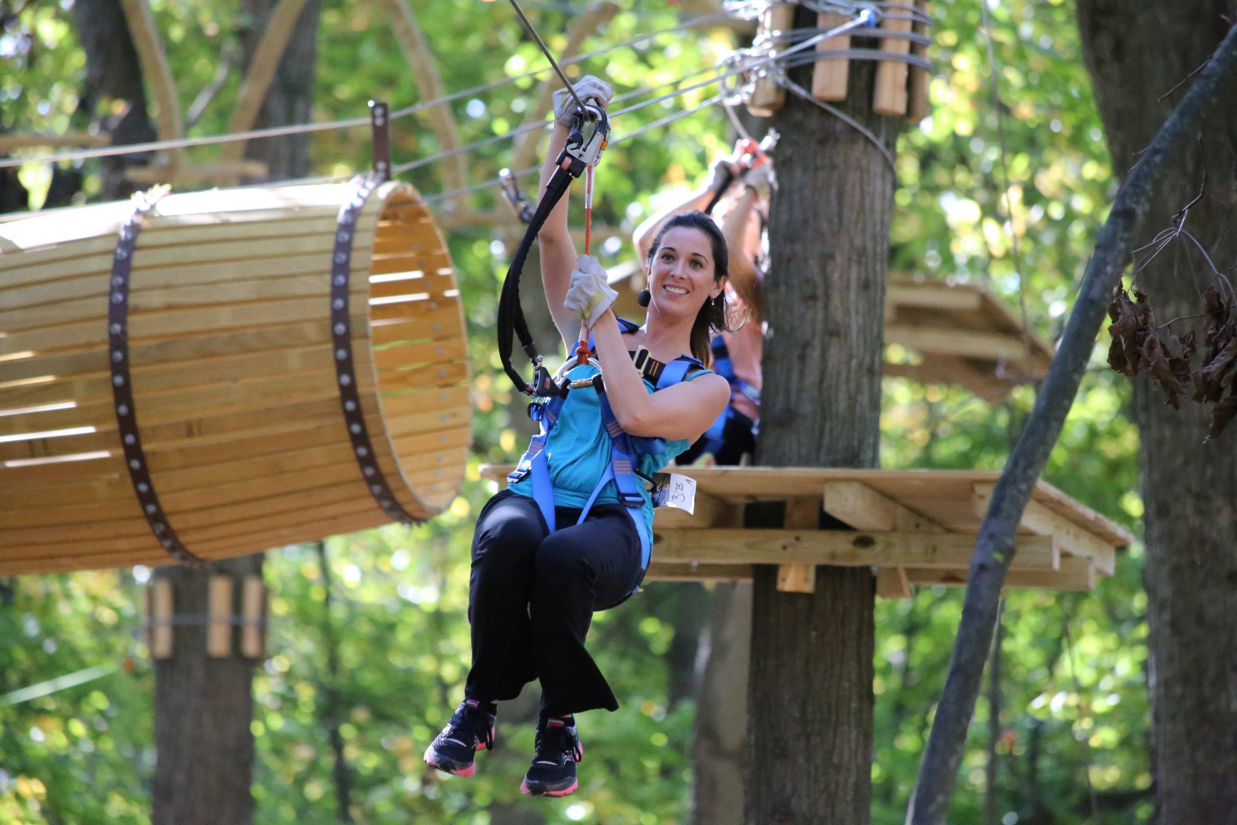 A woman on an aerial course.