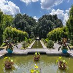 Untermyer pool and gardens in full bloom on a sunny day.