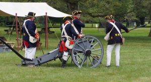 Continental Army soldiers loading a cannon for a firing demonstration at RevCon at the Franklin D. Roosevelt Presidential Library and Museum in Hyde Park.