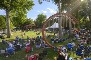 A crowd is gathered at Caramoor for a concert.