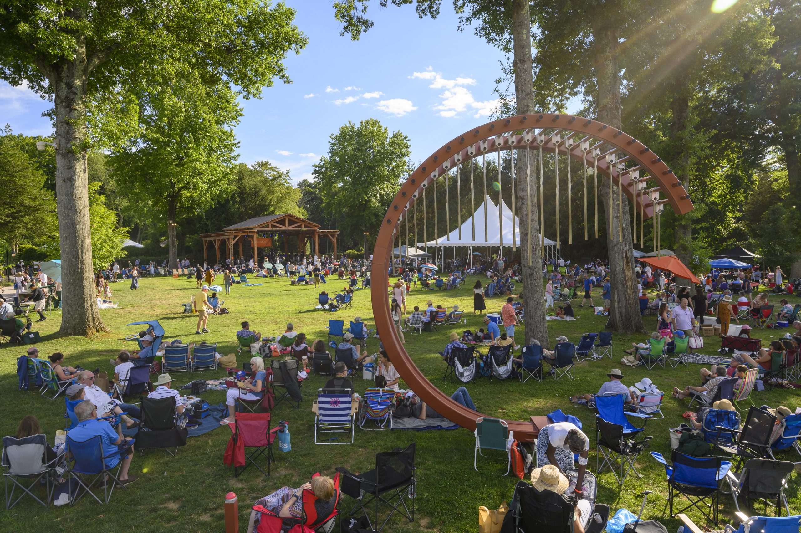 A crowd is gathered at Caramoor for a concert.