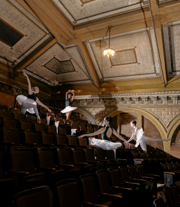 Ballet dancers pose in the balcony area of Tarrytown Music Hall.