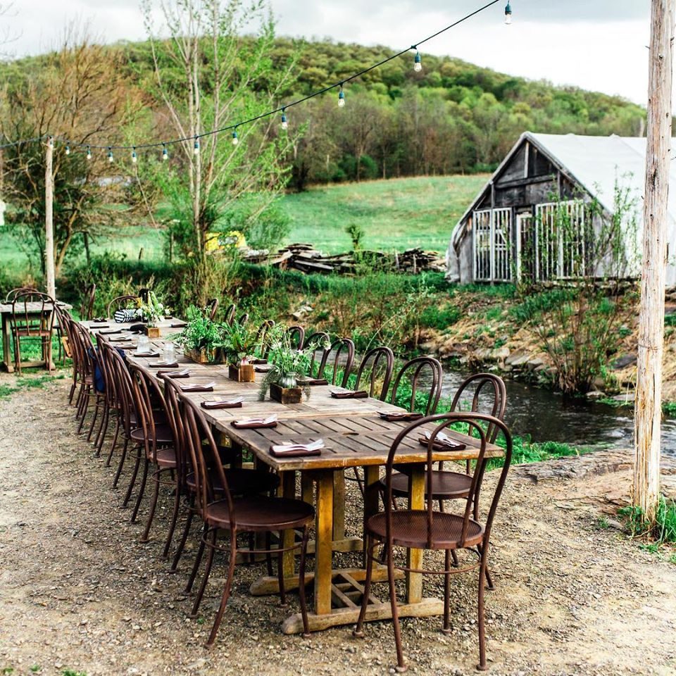 Outdoor dinner table setup at Blooming Hill Organic Farm