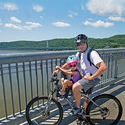 Parent and child biking on the Walkway Over the Hudson