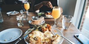 Plate of food and drinks at a brunch meal