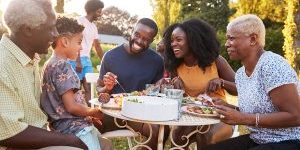 Family eating a meal outdoors